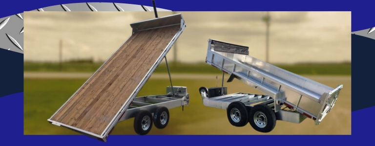 Side-by-side aluminum tilt trailers showing raised hydraulic decks for cargo transport