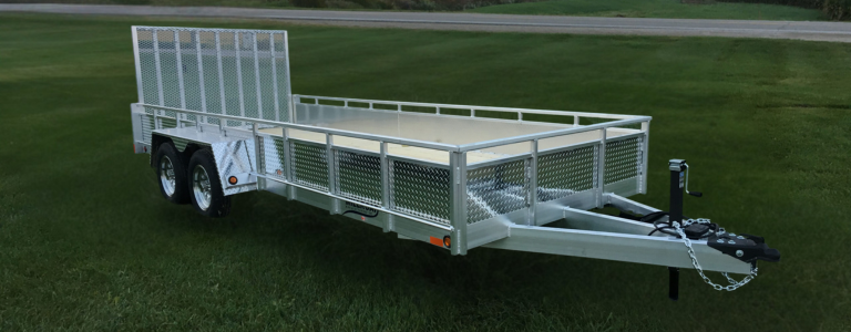 Millroad long-bed aluminum landscape trailer with dual axles and mesh sides on grass field
